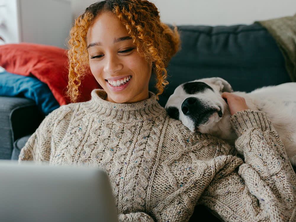 woman comforts newly adopted pet