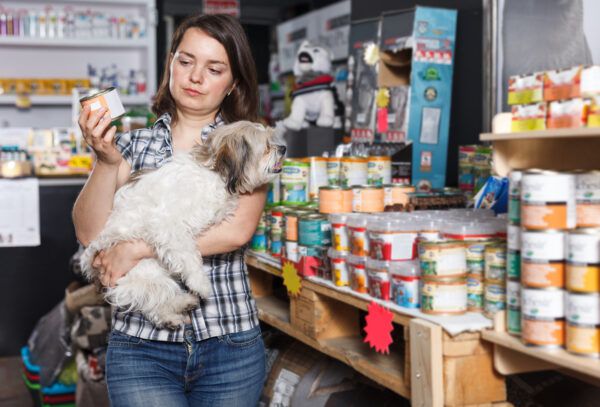 female with dog choosing preserves