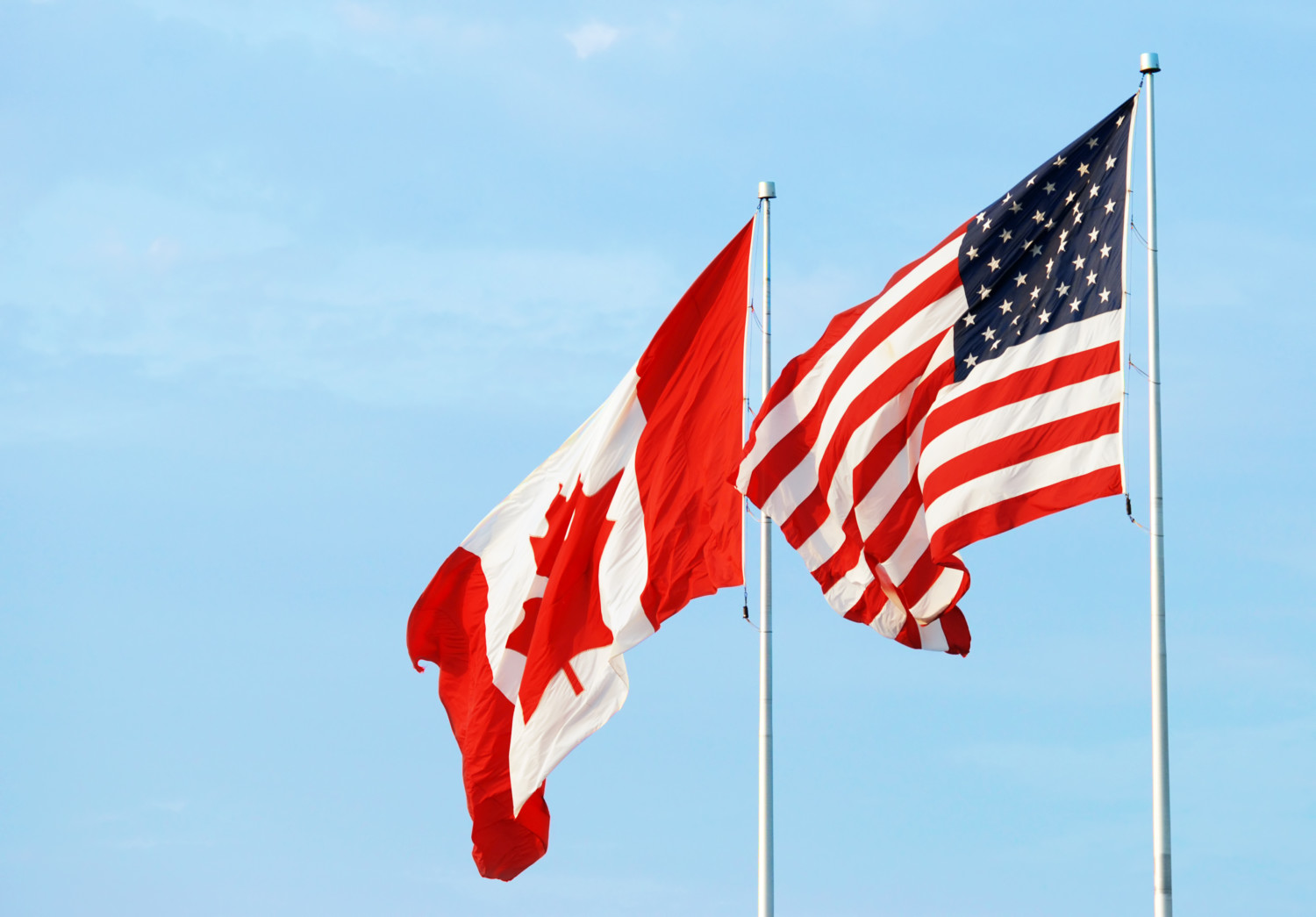  The Canadian and U.S. flags flying side-by-side